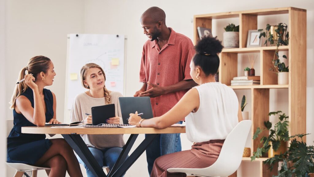 Team collaborating on growth strategy using Nucleus business solutions to scale operations.