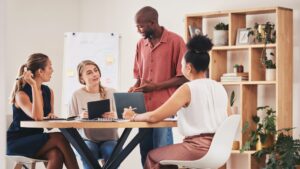 Team collaborating on growth strategy using Nucleus business solutions to scale operations.