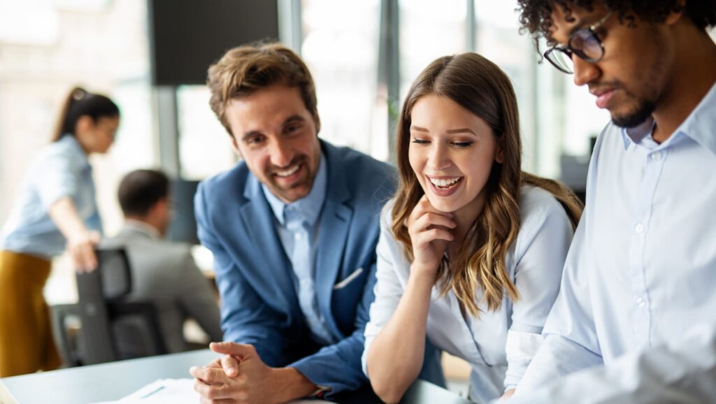 A team of professionals collaborating in an office, leveraging business automation tools to improve efficiency and drive growth.