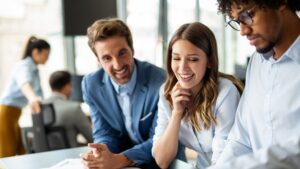 A team of professionals collaborating in an office, leveraging business automation tools to improve efficiency and drive growth.