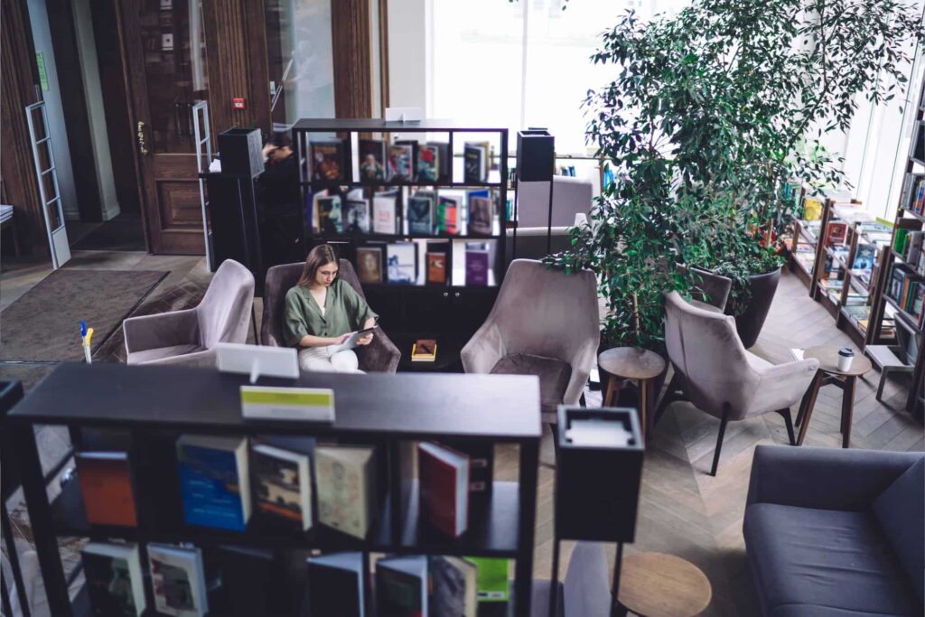 Modern library space with readers and digital tools, representing how Nucleus Service supports library management and operational efficiency