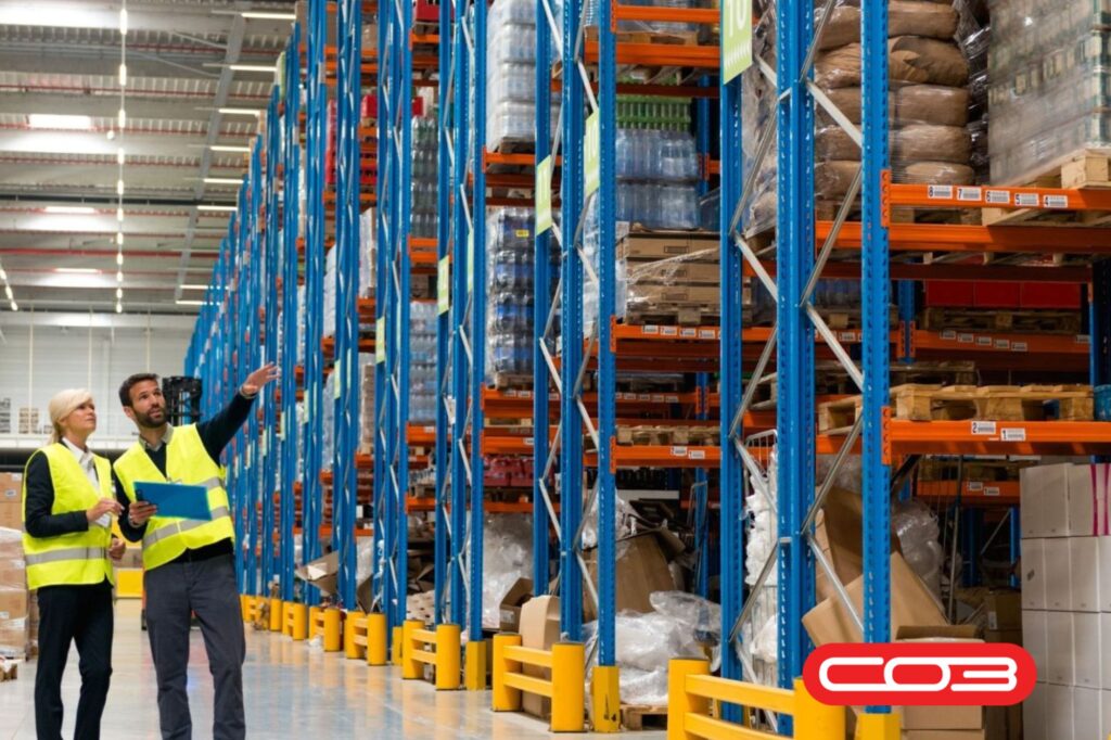 Warehouse managers reviewing stock using an inventory management system for efficient ERP integration and stock control.