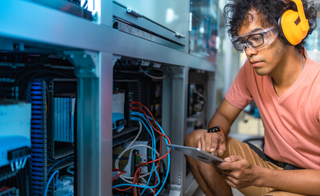 Technician using a tablet with field service dispatch software to access job details, update service records, and improve first-time fix rates.